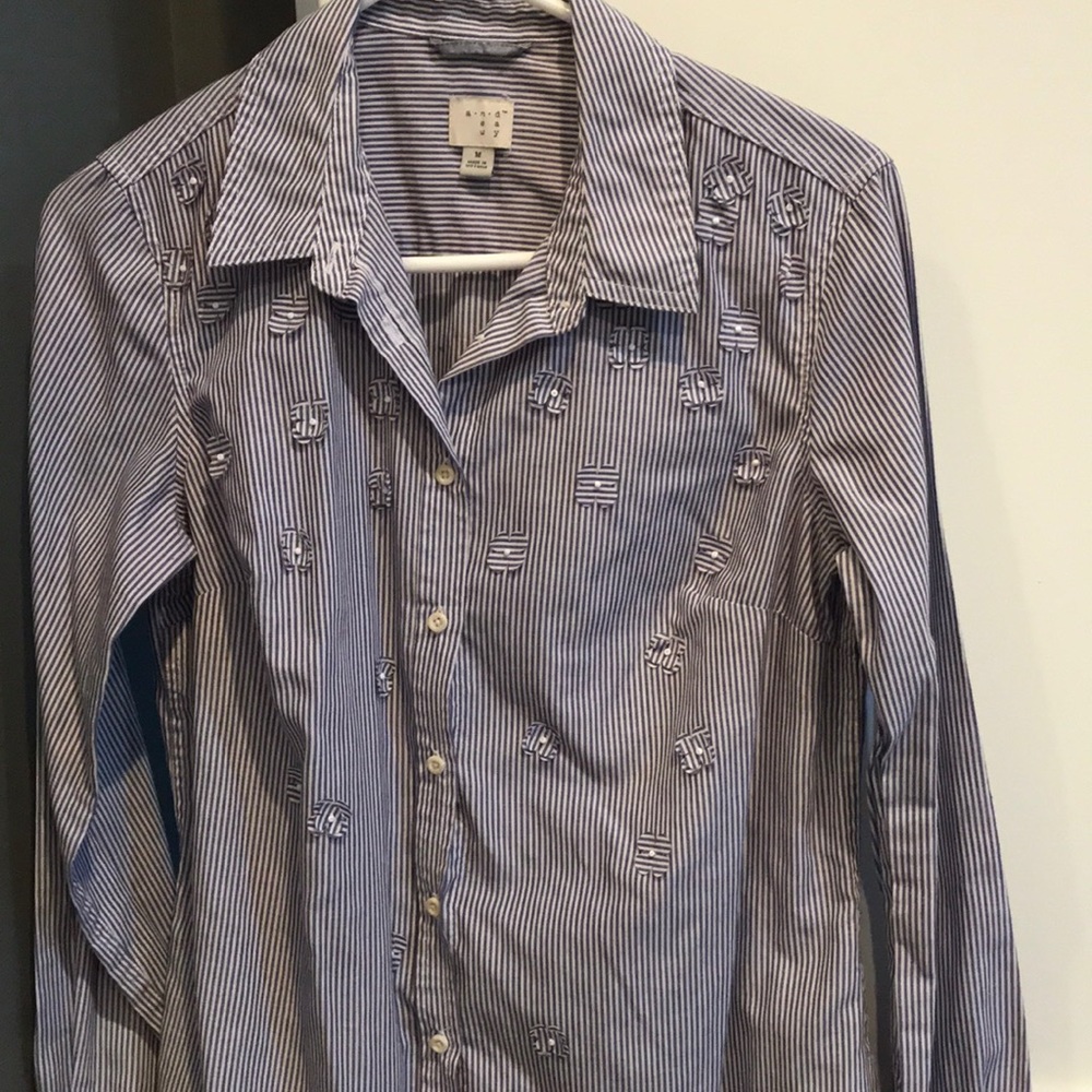 Blue striped button down blouse with flower detail